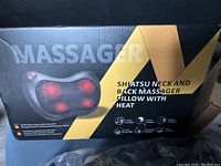 Box of the Shiatsu neck and back massager pillow with heat, showing product name and image.