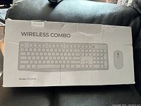 Box showing the wireless combo keyboard and mouse model PC230A, labeled WIRELESS COMBO with image of keyboard and mouse.