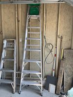 Full view of the 8 ft Werner aluminum stepladder standing upright, showing overall condition and structure
