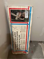 Boxed decorative wooden windmill kit with multilingual packaging showing the assembled windmill image and details.