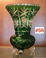 Full view of the green cut-to-clear Bohemian glass vase showing shape and tripod feet