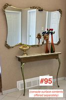 Full view of console and matching wall mirror against wall