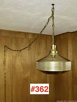 Full view of lamp hanging from ceiling by chain, showing overall design and chain length