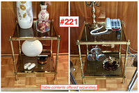 Pair of vintage brass and glass square end tables displayed side by side, holding various decorative items. Both show the overall design and condition.