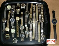 Overhead tray view showing all watches and loose straps