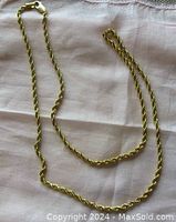 Full view of the rope chain laid flat on fabric.