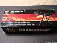 Bushmaster spotting scope original box showing product branding and slogan.
