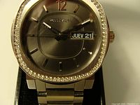 Front view showing grey dial, applied markers, Wittnauer logo, day-date window and crystal-set bezel