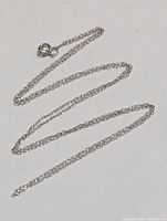 Photo of entire 18-inch chain laid out on flat surface showing length and detail of links.