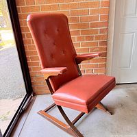 Front three-quarter view showing overall design, upholstery, and frame