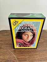National Geographic DVD-ROM collection box with cover featuring the Afghan Girl photograph and text highlighting 125 years of issues since 1888.
