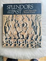 Front cover of the book showing title and a bas-relief image of ancient figures.