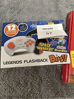 Photo of sealed Atari Legends Flashback Blast box featuring 12 built-in games.