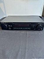 Front view of Kenwood stereo control amplifier KC-992 showing display, knobs, buttons, and headphone jack.