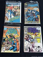 Overview of all 4 comics showing their covers: Justice League 2017, Spider-Man 1987, Heroes Against Hunger 1986, Alpha Flight 1987