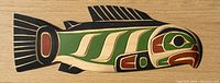 Full front view of salmon plaque showing carving and paint colors