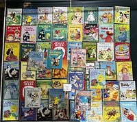 Top view of the large collection of Golden Books with visible titles and colorful covers.
