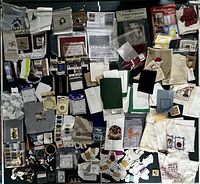 Overview photo showing all cross stitch patterns, kits, yarn, beads, buttons, hem tape, rings, mesh sheets, and other craft supplies arranged in a box