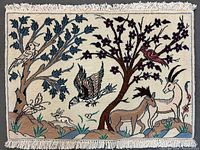Full rectangular ivory rug with fringe, pictorial design of trees, birds and goats