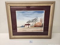 Framed watercolour painting showing the entire artwork with beige frame and burgundy matting.