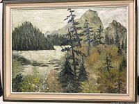 Full view of the framed landscape oil painting showing a mountain scene, lake, and trees.