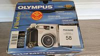 Original boxed Olympus Camedia C-2020 Zoom digital camera showing branding and model on front of box.