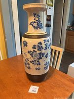 Full view of urn on wooden table