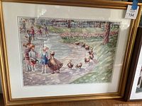 Full front image of the framed print showing the artwork, the gold frame, and the white matting.