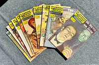 Set of 10 vintage Classics Illustrated comic books spread in a fan shape showing front covers with titles and colorful illustrations.
