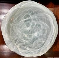 Top view showing detailed swirl design and irreglar wavy rim