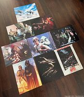 Photo showing 10 Star Wars Trilogy 11x14 movie cards arranged on the floor, featuring various iconic scenes and characters from the trilogy.
