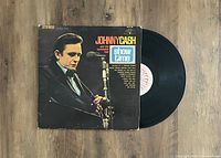 Vinyl LP and album cover with Johnny Cash pictured, titled 'Show Time' by Johnny Cash and the Tennessee Two