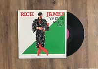 Album cover and vinyl LP record showing artwork and label