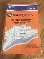 Front cover of the 1982 Perlys Map Book Metro Toronto and Vicinity showing the orange cover, 24th edition, 1982-83.