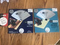 Two new 10 inch Sears Craftsman Kromedge saw blades in original packaging, one with an illustration showing the blade on a table saw.