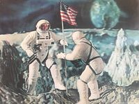 Close-up of the front glossy 3D picture showing two astronauts, one planting the American flag on the moon, with Earth visible in the background.