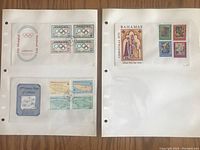 Two protective pages with three First Day of Issue stamp covers from Jamaica and Bahamas showing Olympic and map themes along with Bahamas Christmas 1976 stamps.