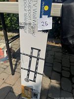 Photo of the Insignia TV wall mount packaging showing the mount size range 47" to 80" and max weight 120 lbs, with a picture of the bracket design.