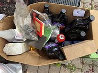 Box with multiple engine products including black Total Power bottles, fuel additive bottle, spray can, air filter and small bottles