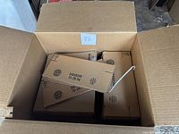 Open box filled with multiple flat packaging product boxes stamped size 10 dated 10/29/04, new condition.