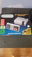 Box of Nintendo Classic Mini system with controller and 30 pre-installed games indicated on box.