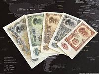 Five Bulgarian banknotes from 10 to 200 Leva displayed fan-like showing front designs.