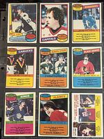 Nine vintage 1980-81 O-Pee-Chee hockey cards shown from front, featuring various NHL players including from maple leafs, capitals, nordiques, canucks, north stars, black hawks, kings, and flames teams.