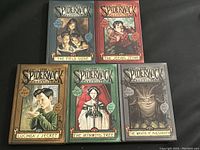 Front view of five Spiderwick Chronicles hardcover books showing unique illustrated covers and titles.