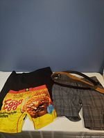 Shorts visual with one featuring Eggo waffle print and the other grey plaid.