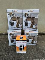 Five boxed space heaters displayed: four GiveBest 1500W ceramic heaters and one Brightown personal electric ceramic heater.