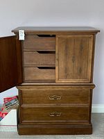 Front view of Villas dresser with left cabinet door open showing three inside drawers and two drawers below