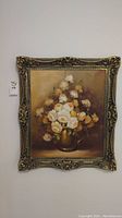 Full view of signed original oil painting of white roses in vase with ornate gold frame