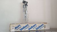 Full view of Velbon tripod standing next to original box showing branding and overall appearance.