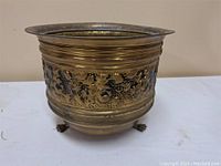 Full view of the brass planter showing shape and decorative band